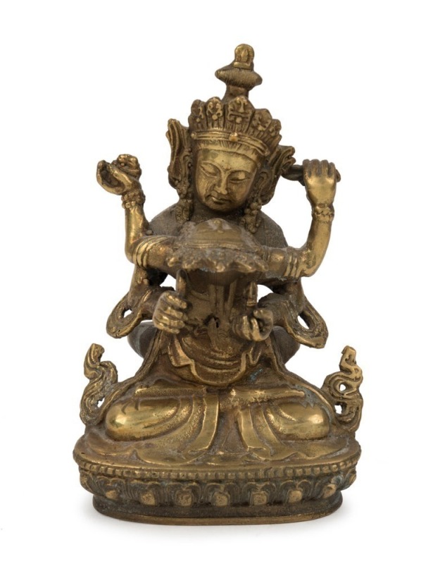 A Tibetan bronze figure group, 19th/20th century,  11cm high 