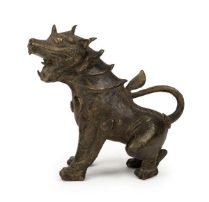A Sino-Tibetan bronze guardian dog, late Ming/early Qing Dynasty, 15cm high