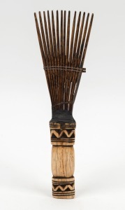 A tribal hair comb, carved tooth, wood and fibre, African origin, 23.5cm long