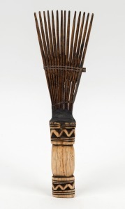 A tribal hair comb, carved tooth, wood and fibre, African origin,  23.5cm long