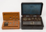 Two boxed sets of weights (incomplete), 20th century,  ​​​​​​​the larger 14cm wide