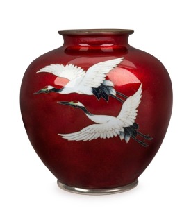 A Japanese pigeon blood cloisonné vase with flying cranes, Meiji period,  16cm high 