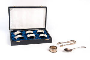 Boxed set of 6 sterling silver napkin rings; sugar tongs; spoon & napkin ring.