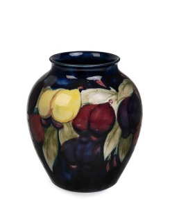 MOORCROFT "Clematis" pattern pottery vase on blue ground, circa 1930, impressed "Moorcroft, Made In England" with blue signature on celadon green ground, ​​​​​​​15.5cm high