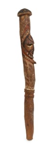 A flute stopper, carved wood and natural earth pigments, Papua New Guinea origin, 65cm high