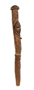 A flute stopper, carved wood and natural earth pigments, Papua New Guinea origin, ​​​​​​​65cm high