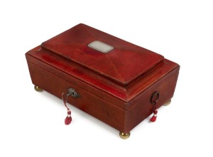 A fine Georgian sewing casket, sarcophagus shaped covered in scarlet leather with silver name plaque, interior sumptuously fitted with original compartments and contents, early 19th century, 14cm high, 28cm wide, 18cm deep