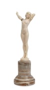 SASSON&nbsp;carved ivory statue of a female nude, on turned onyx base, early 20th century, signed "L. Sasson", 16.5cm high