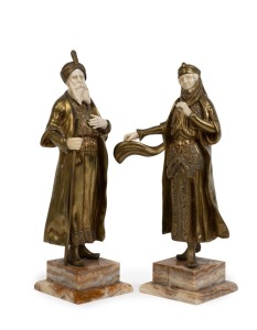 A pair of antique French Orientalist style statues, cast and gilt bronze with carved ivory on onyx bases, early 20th century, stamped "Made in France, Bronze", 24cm and 25cm high