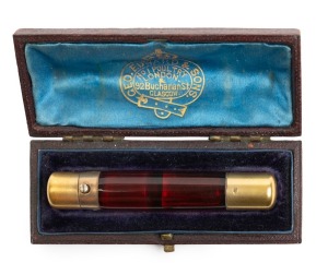 An antique English ruby glass double ended scent bottle with gilded sterling silver ends by Sampson Mordan, housed in original plus fitted box with retailer's details "Geo. Edward & Sons" of London & Glasgow, 19th/20th century, 8.5cm long, the box 10cm wide