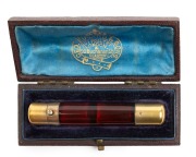 An antique English ruby glass double ended scent bottle with gilded sterling silver ends by Sampson Mordan, housed in original plus fitted box with retailer's details "Geo. Edward & Sons" of London & Glasgow, 19th/20th century, 8.5cm long, the box 10cm wi