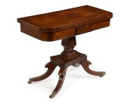 A Regency fold-over card table, mahogany with macassar ebony inlay decoration on splay quatrefoil pedestal base, 19th century, 72cm high, 91cm wide, 46cm deep 