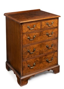 An antique English bachelor's chest of five drawers in the George I style, book matched walnut veneers, standing on bracket feet, circa 1900, 78cm high, 61cm wide, 49cm deep