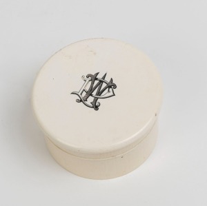 An antique ivory jewellery box with monogram top, late 19th century, 5cm high, 8.5cm diameter