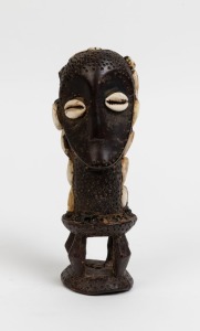 A tribal statue, carved ivory, shell and clay, African origin, ​​​​​​​20cm high