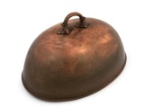 An antique copper meat dish cover, 19th century, 22cm high, 40cm wide