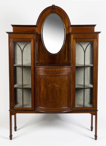 An antique English mahogany and string inlay display cabinet, bow fronted central storage below an oval mirror, early 20th century, ​​​​​​​186cm high, 121cm wide, 35cm deep