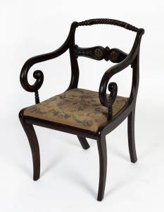 A Regency carver chair, stained beech with gilded highlights and tapestry drop-in seat, circa 1825, 53cm across the arms