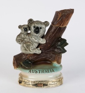 A "Beam's Trophy" Kentucky Straight Bourbon Whiskey decanter in the shape of a koala and joey sitting on a branch; dated 1973.