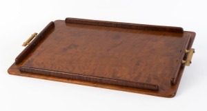 A Tasmanian myrtle serving tray with fiddleback blackwood gallery and bakelite handles, circa 1925, 58cm across the handles