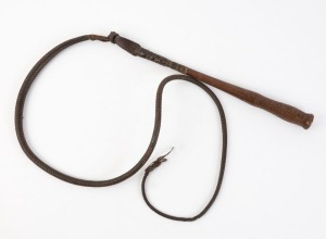 An antique Australian stock whip, handle carved with owner's details and dated 1878, 19th century, the handle 37cm long