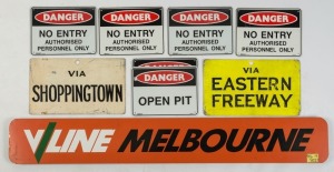 Nine assorted metal signs including "V LINE", "TRAMWAYS" and "SAFETY",  the largest 139cm wide