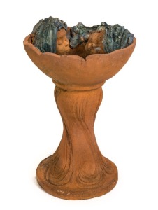 ARTIST UNKNOWN Australian studio pottery birdbath decorated with female faces, monogram stamp to side of the base, ​​​​​​​62cm high, 42cm wide