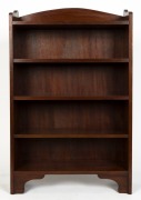 An Australian blackwood set of open bookshelves with an arch-top rail back and bracket feet, circa 1920, 122cm high, 77cm wide, 34cm deep