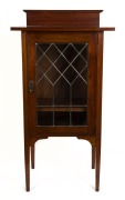 An Australian blackwood music cabinet with diamond leadlight door and double-panelled sides, circa 1925, 116.5cm high, 61cm wide, 43cm deep