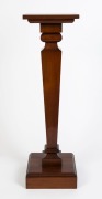 An Australian blackwood pedestal with square top, conforming plinth base and tapering column, circa 1920, 98.5cm high, 29cm wide, 29cm deep