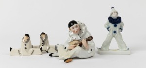 Continental porcelain statue of Pierrot flute player together with a ROSENTHAL clown statue signed "Ferd. Liebermann" and a pair of SEVRES porcelain figural knife rests, (4 items), the largest 15.5cm high