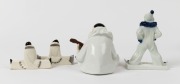 Continental porcelain statue of Pierrot flute player together with a ROSENTHAL clown statue signed "Ferd. Liebermann" and a pair of SEVRES&nbsp;porcelain figural knife rests, (4 items), the largest 15.5cm high - 2