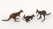 Three painted lead kangaroo figures, 20th century, the largest 5cm high, 7cm long