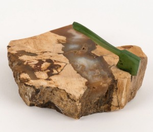 A New Zealand fossilised mineral specimen with nephrite greenstone axe, 20th century, 9.5cm wide