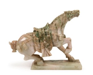 An antique Chinese carved jade horse statue, Qing Dynasty, 19th century or earlier, 13.5cm high, 17cm long