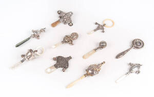 BABY RATTLES: Group of 10 mainly silver rattles with handles.