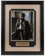 BOB DYLAN, original autograph in blue felt-tip pen on attractive photograph of Dylan; framed and glazed. Accompanied by a Certificate of Authenticity from R&R Enterprises, New Hampshire, and a PSA/DNA Certificate of Authenticity.