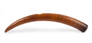 A tribal musical horn, carved ivory with remains of incised and pecked decoration. Very attractive antique patination, Nigerian origin, 61cm long