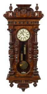 An impressive antique Vienna regulator wall clock with walnut veneered case, turned column decoration, eight day time and strike weight driven movement, and Roman numerals, 19th century, 140cm high