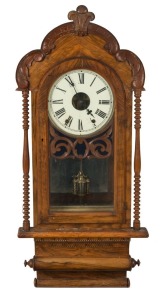 An antique American wall clock in walnut and parquetry case, eight day time and strike movement with Roman numerals, 19th century, 95cm high