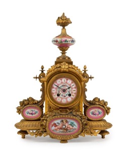 An antique French mantle clock, ormolu case with pink Serves porcelain panels, eight day time and strike movement with Roman numerals, mid 19th century,  ​​​​​​​43cm high