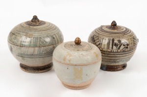 Three antique Thai ceramic lidded pots, 15th/16th century,  the largest 12cm high, 12cm wide