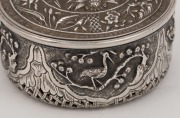 An antique Vietnamese floral circular box with fine repousse work depicting animals and flowers with pierced basket weave base, 19th century,  4cm high, 7.5cm diameter - 2