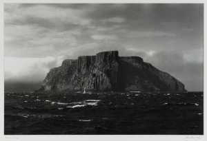 ROBERT COCK "Tasman Island", framed black and white photographic print, signed and titled in the lower margin and dated 2006, ​​​​​​​76 x 100cm overall