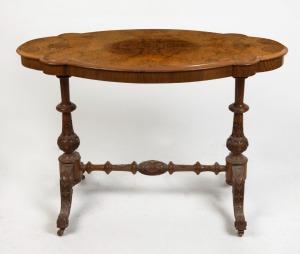 An antique English scalloped edged occasional table with quarter book matched burr walnut veneered top, and Irish influenced carved cabriole leg stretcher base, 70cm high, 107cm wide, 61cm deep.