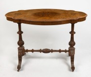 An antique English scalloped edged occasional table with quarter book matched burr walnut veneered top, and Irish influenced carved cabriole leg stretcher base, 70cm high, 107cm wide, 61cm deep.