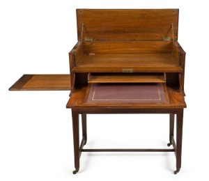 A rare antique English traveling metamorphic desk and folio cabinet, with adjustable leather inset writing surface; walnut veneer, original brass hardware fitted to single drawer desk base with brass castors, 19th century. 103cm high, 87cm wide, 55cm deep.
