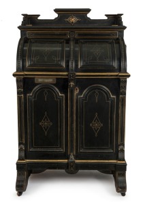 An impressive antique American Wooton desk, ebonized mahogany with incised gilt decoration and fitted panels throughout, 19th century. Opening to reveal numerous shelves and pigeonholes, with fall-front writing surface supported with mechanical metal brac
