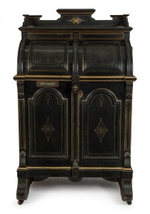 An impressive antique American Wooton desk, ebonized mahogany with incised gilt decoration and fitted panels throughout, 19th century. Opening to reveal numerous shelves and pigeonholes, with fall-front writing surface supported with mechanical metal bracket lopers. (serial number 01012), 156cm high, 183cm wide (opened), 67cm deep.
