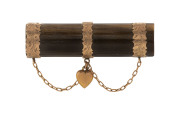 An antique rose gold bar brooch set with large tiger's eye specimen, 19th century, 5.2cm wide
